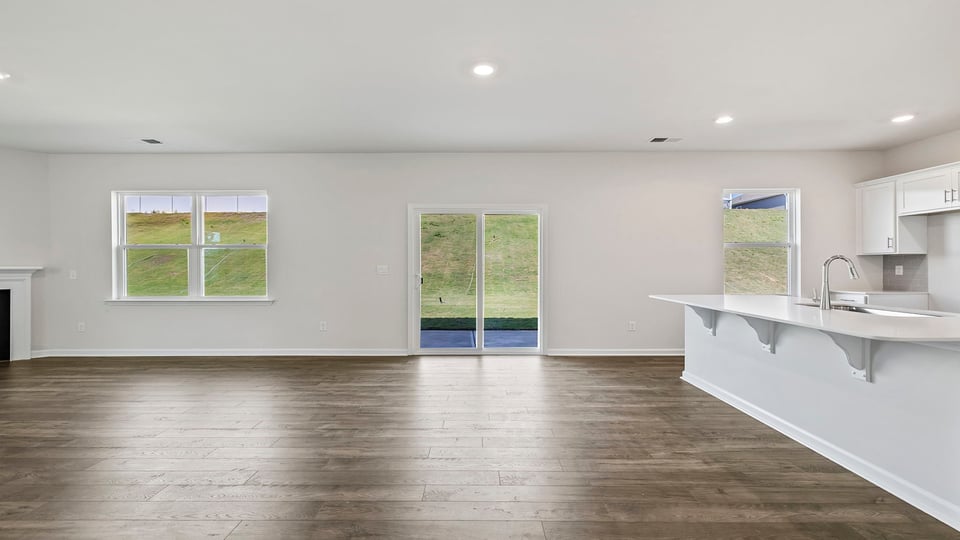 Kitchen and island with granite counter tops.