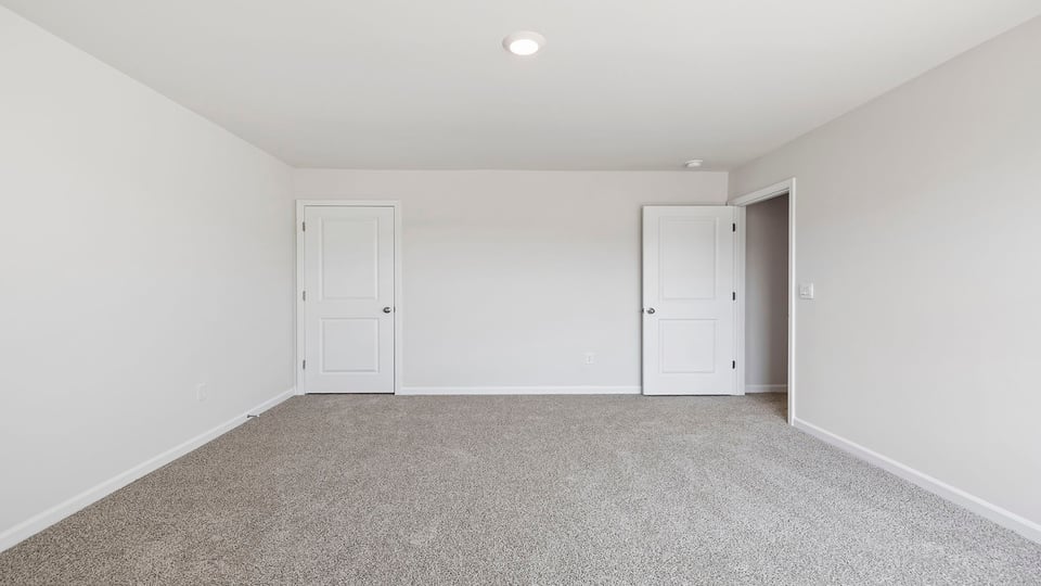 Bedroom with carpet.