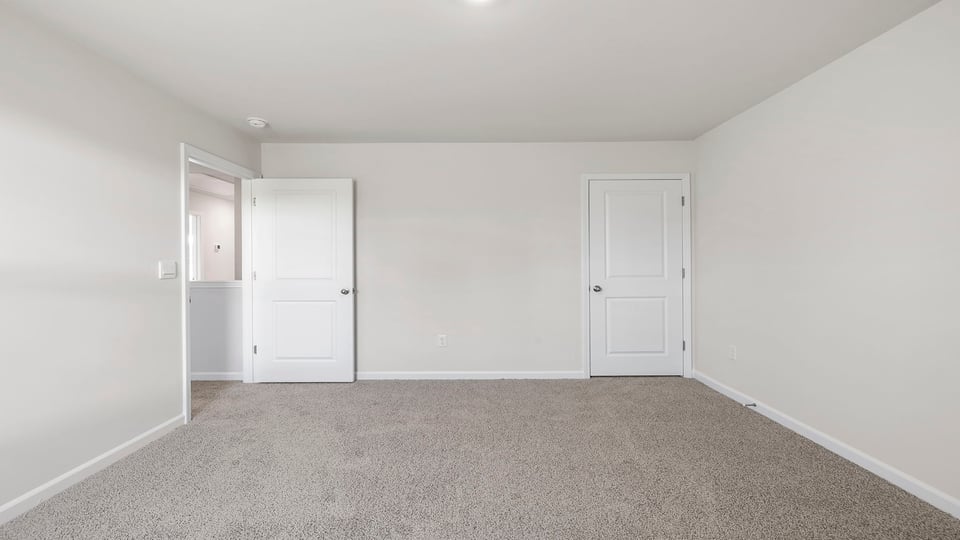 Bedroom with carpet.
