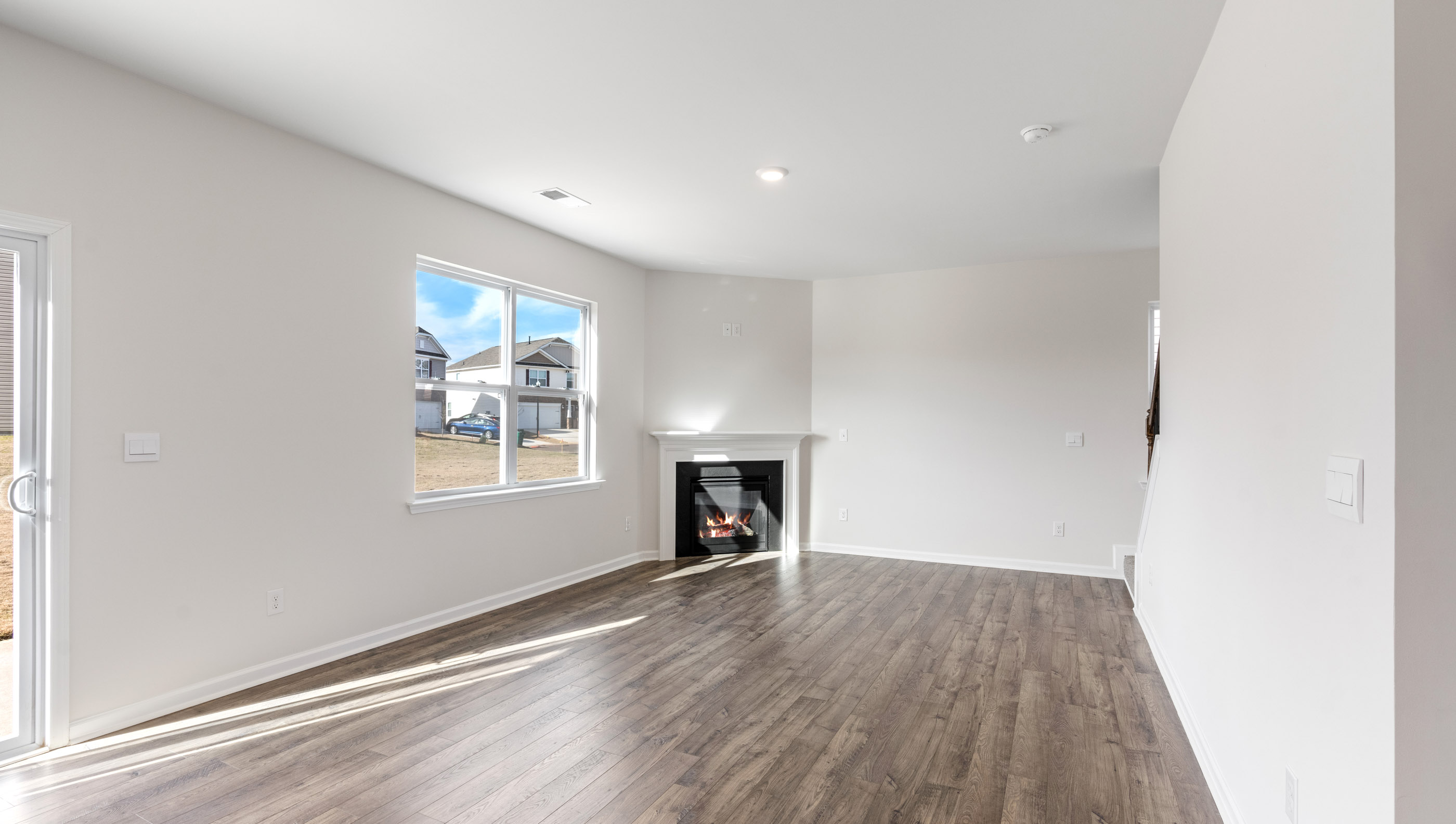 Great room with fireplace and windows.