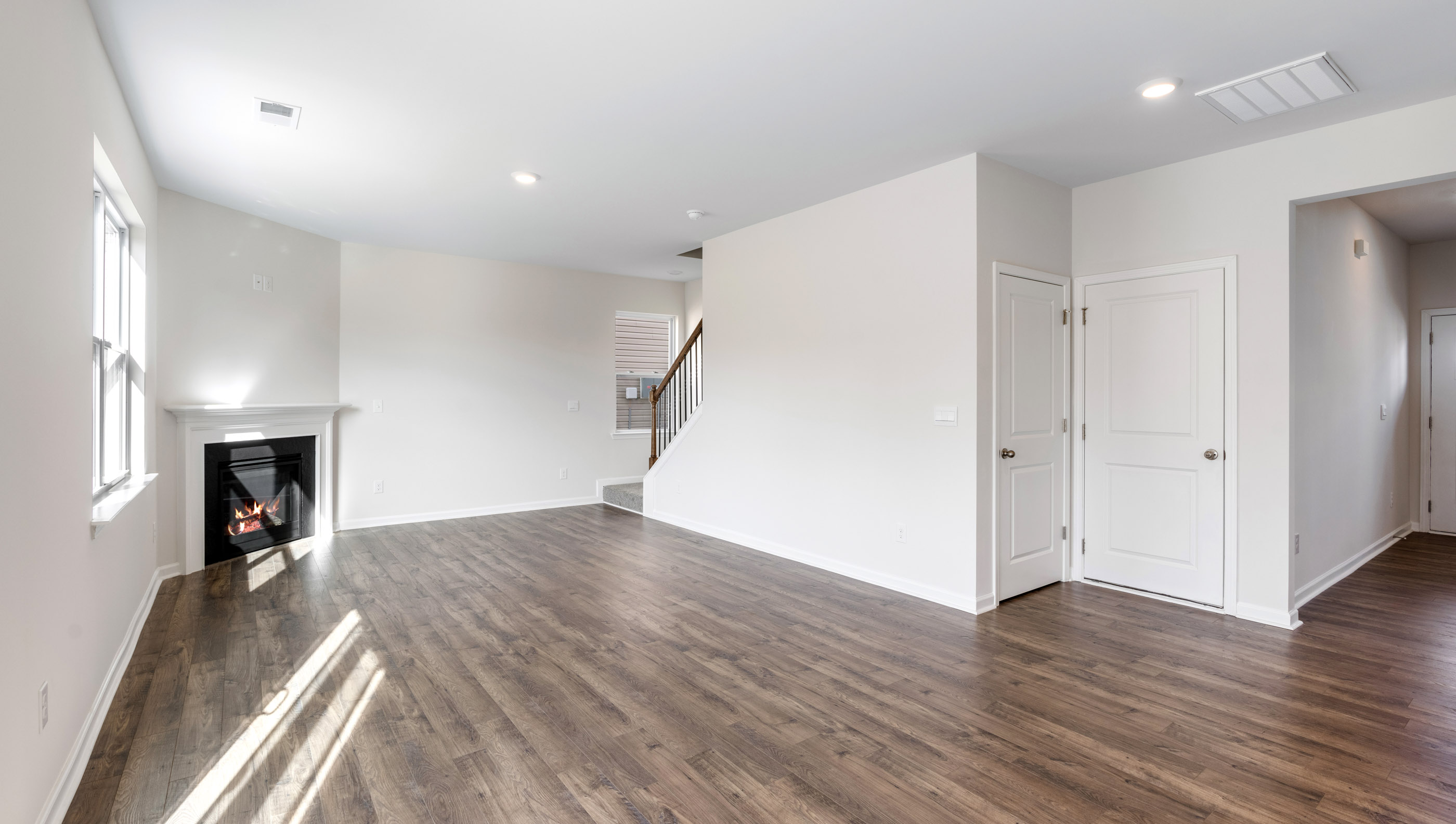 Great room with fireplace and windows.