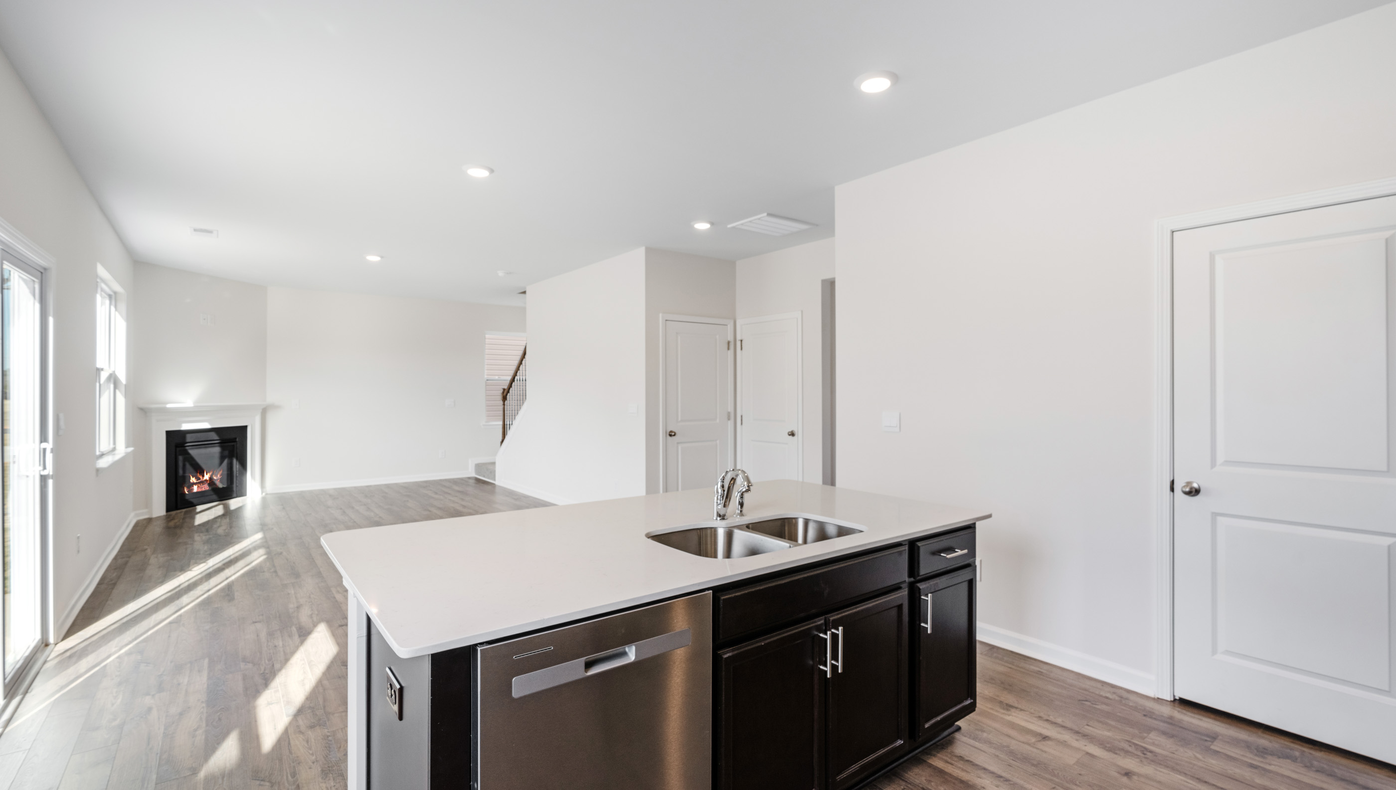 Kitchen with island and granite countertops.