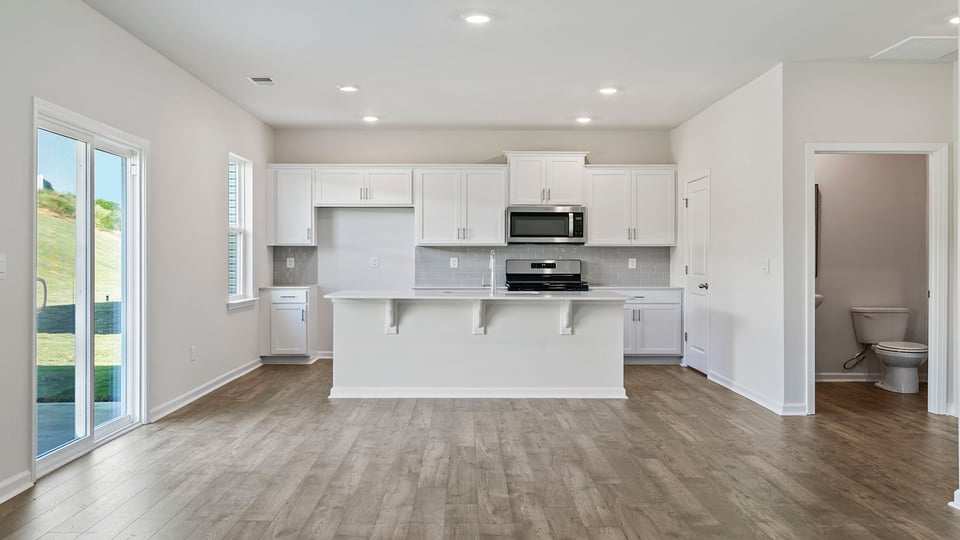 Kitchen and island with granite countertops.