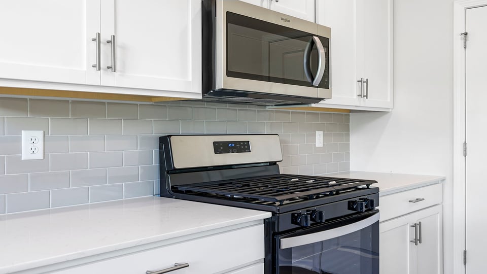Kitchen with granite countertops and stainless steel appliances.