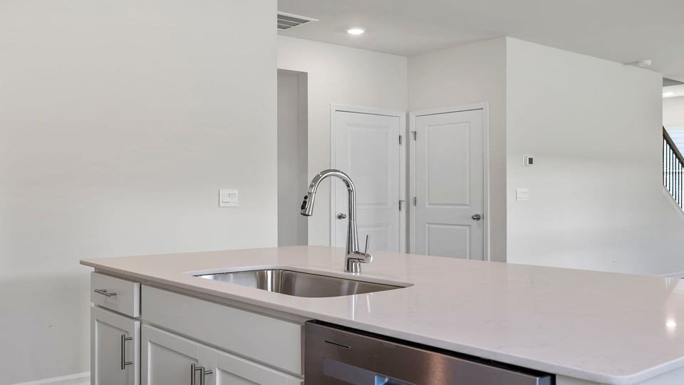 Kitchen and island with granite countertops.