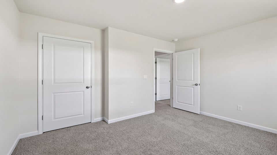 Bedroom with carpet.