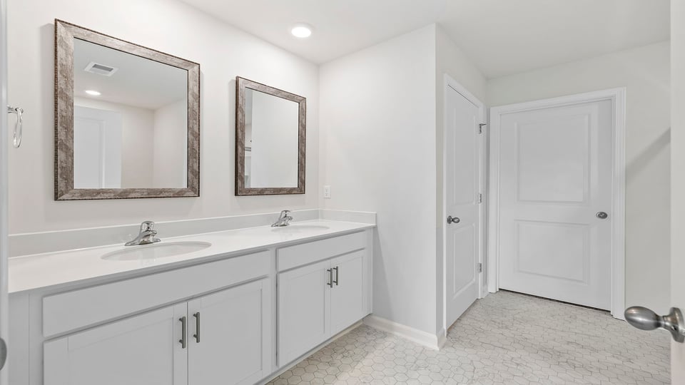 Bathroom with dual vanity.
