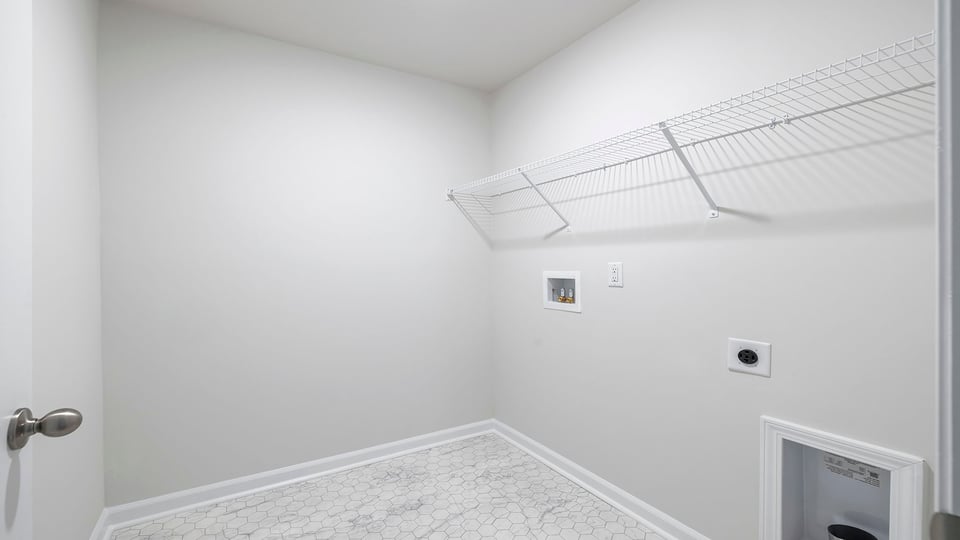 Walk in laundry with shelves.
