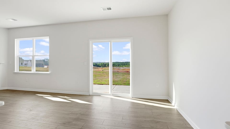Livingroom with fireplace with window.