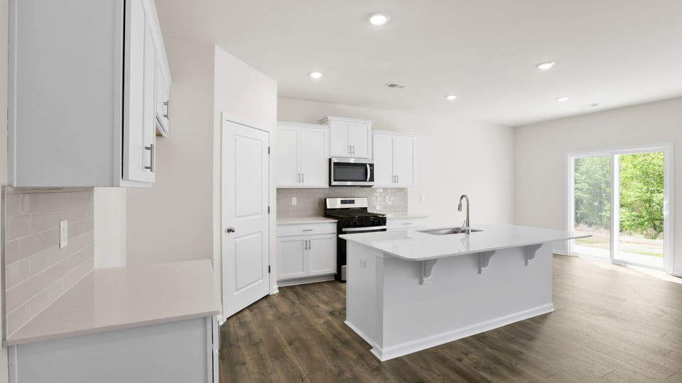 Kitchen with island and countertops.