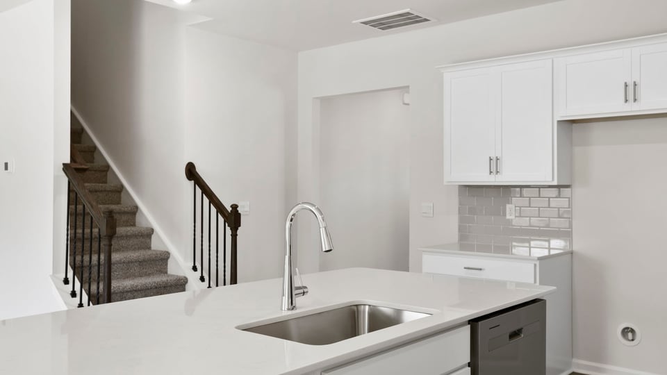 Kitchen with island and countertops.