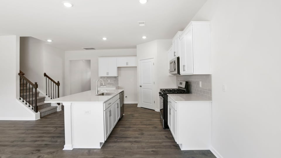 Kitchen with island and countertops.