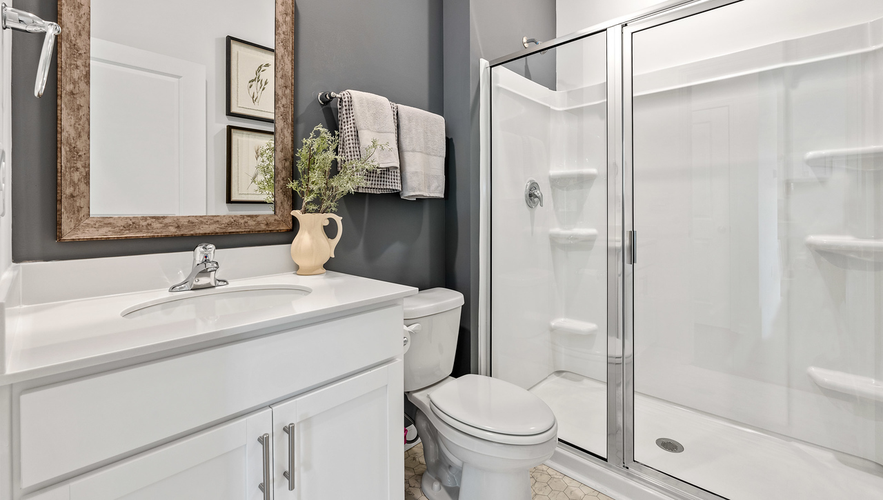 Bathroom with vanity and shower.