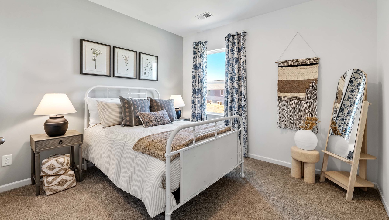 Bedroom with carpet and window.