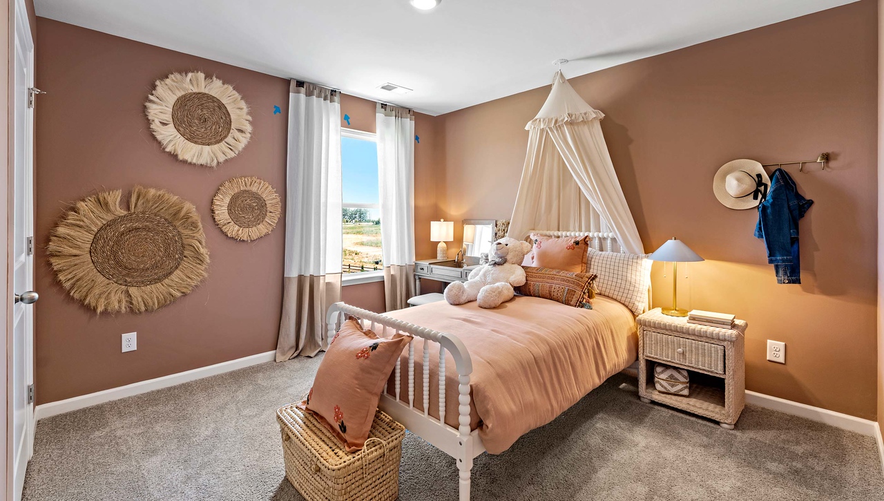 Bedroom with carpet and window.