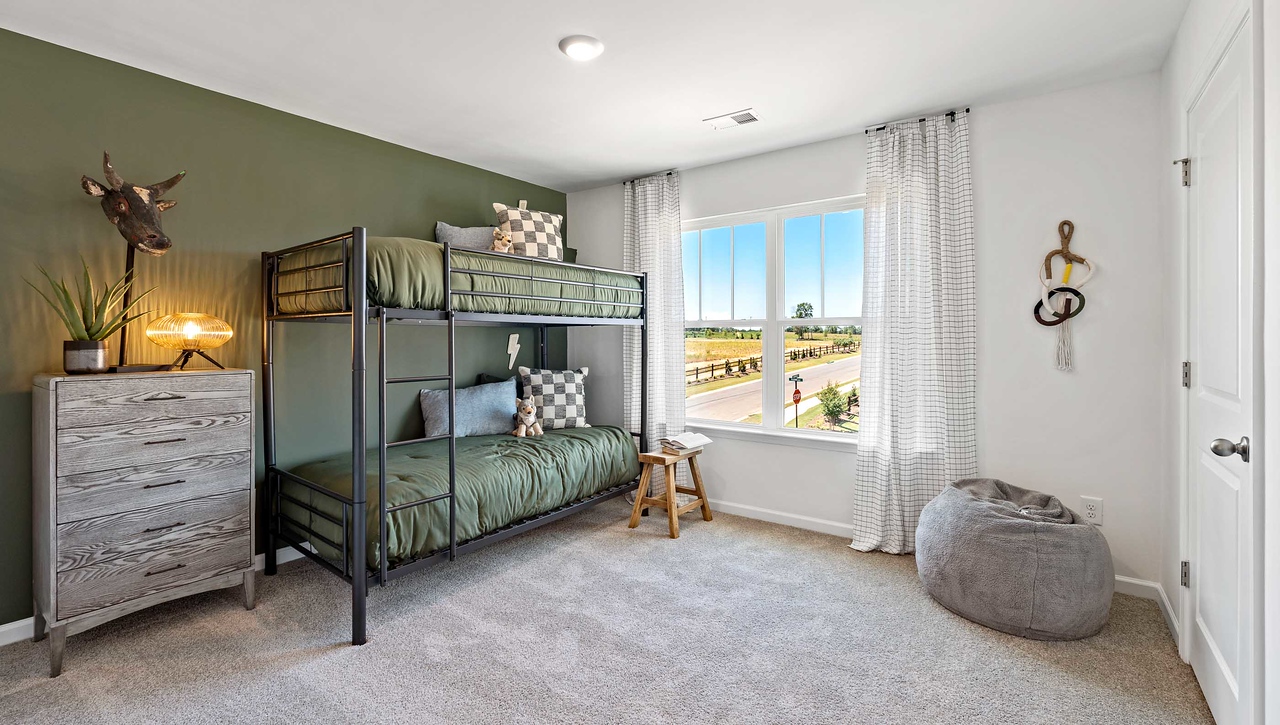 Bedroom with carpet and window.