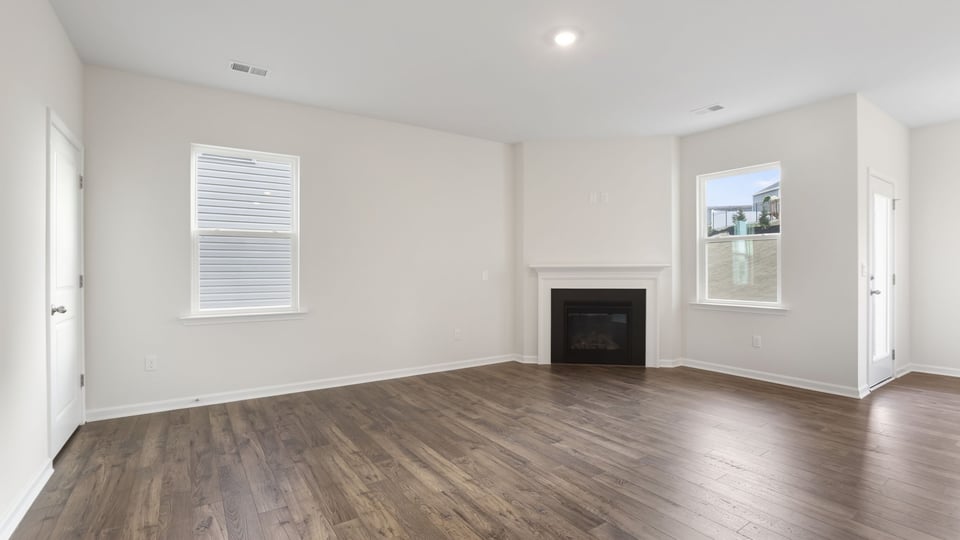Livingroom with Fireplace and windows.