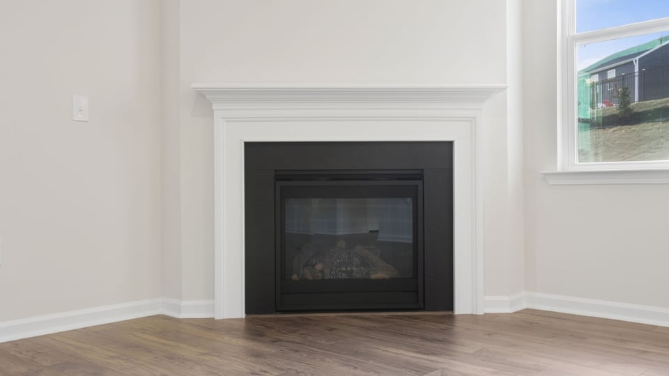 Livingroom with Fireplace and windows.