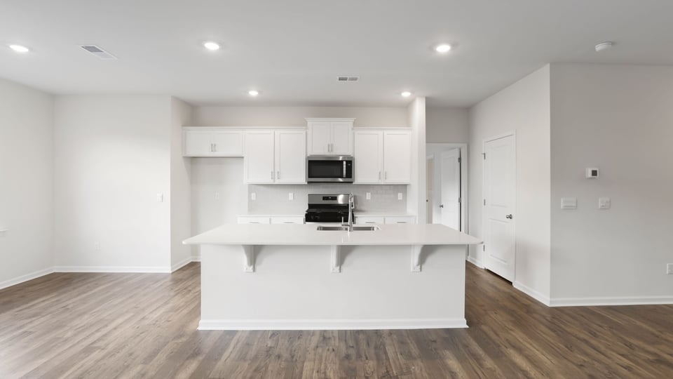 Kitchen with island and countertops.