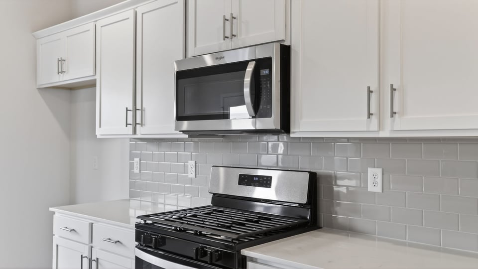 Kitchen with island and countertops.