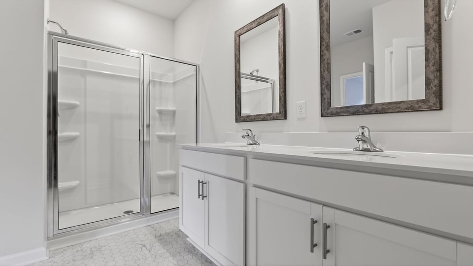 Bedroom with vanity and tub.