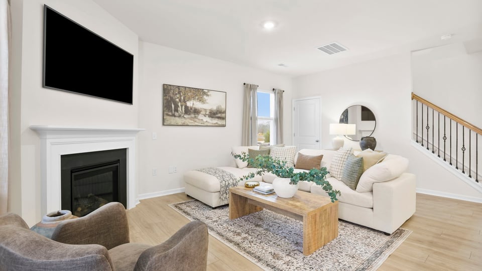 Living room with windows and fireplace.