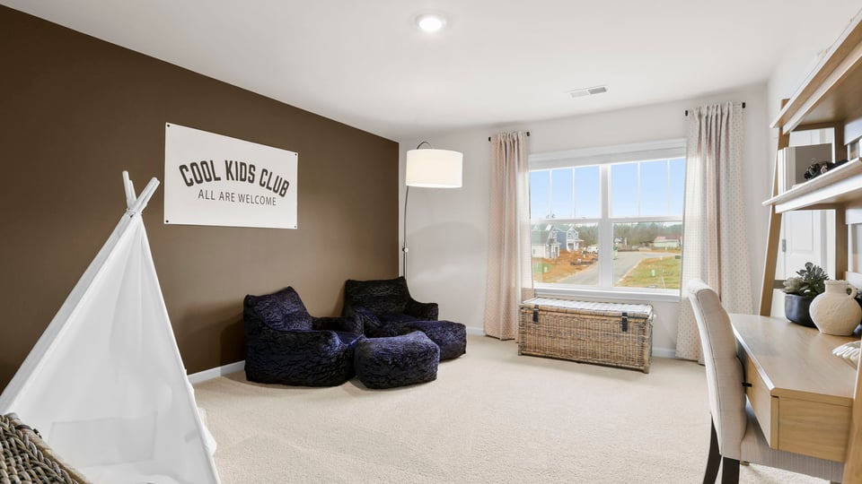 Bedroom with carpet and window.