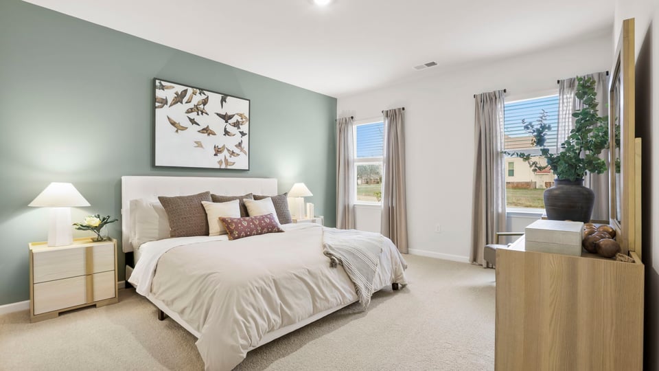 Bedroom with carpet and window.