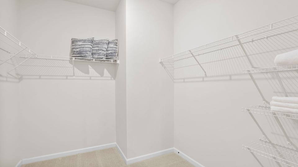 Closet with hanging storage racks.