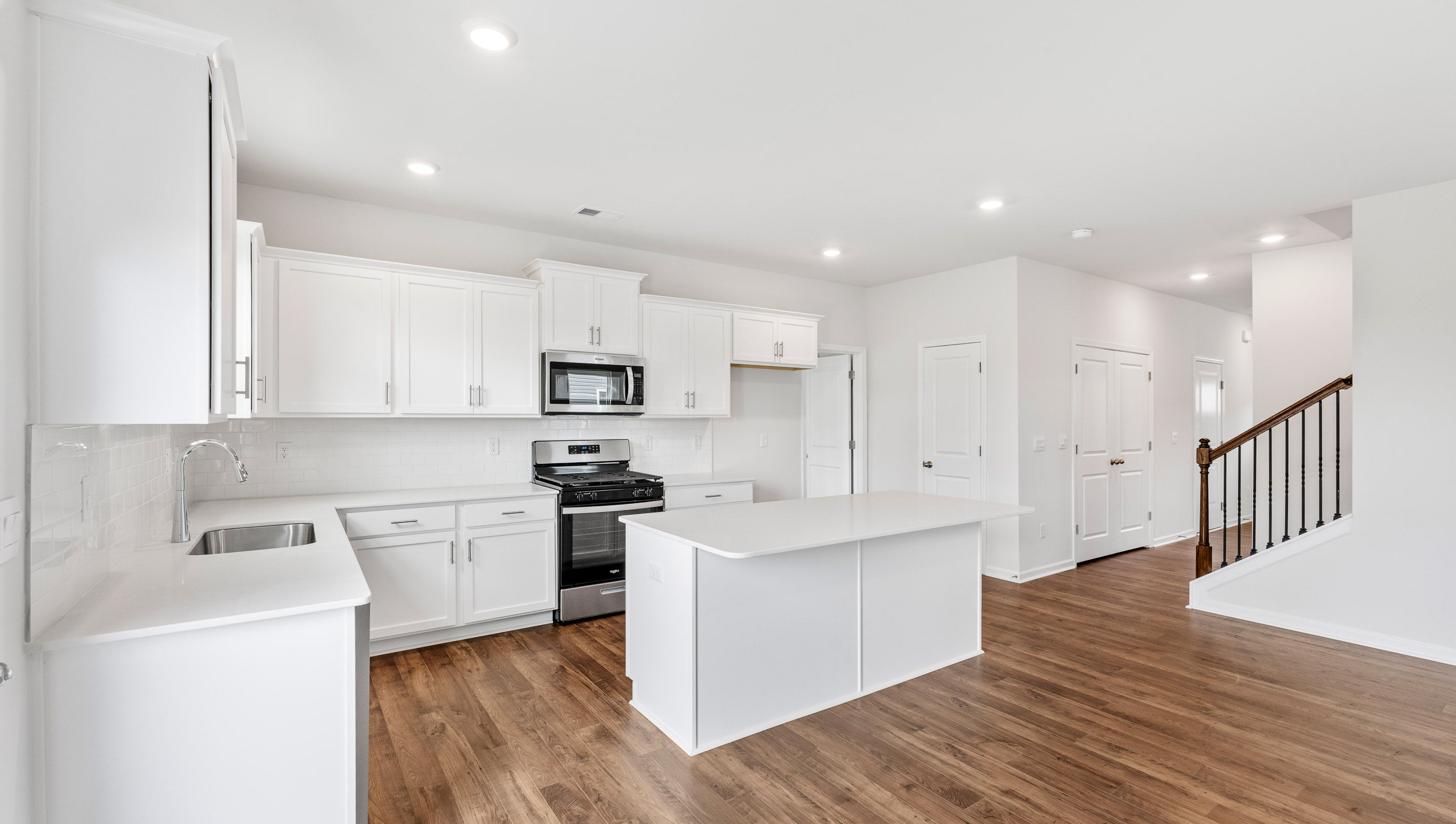 Kitchen with island and fireplace.