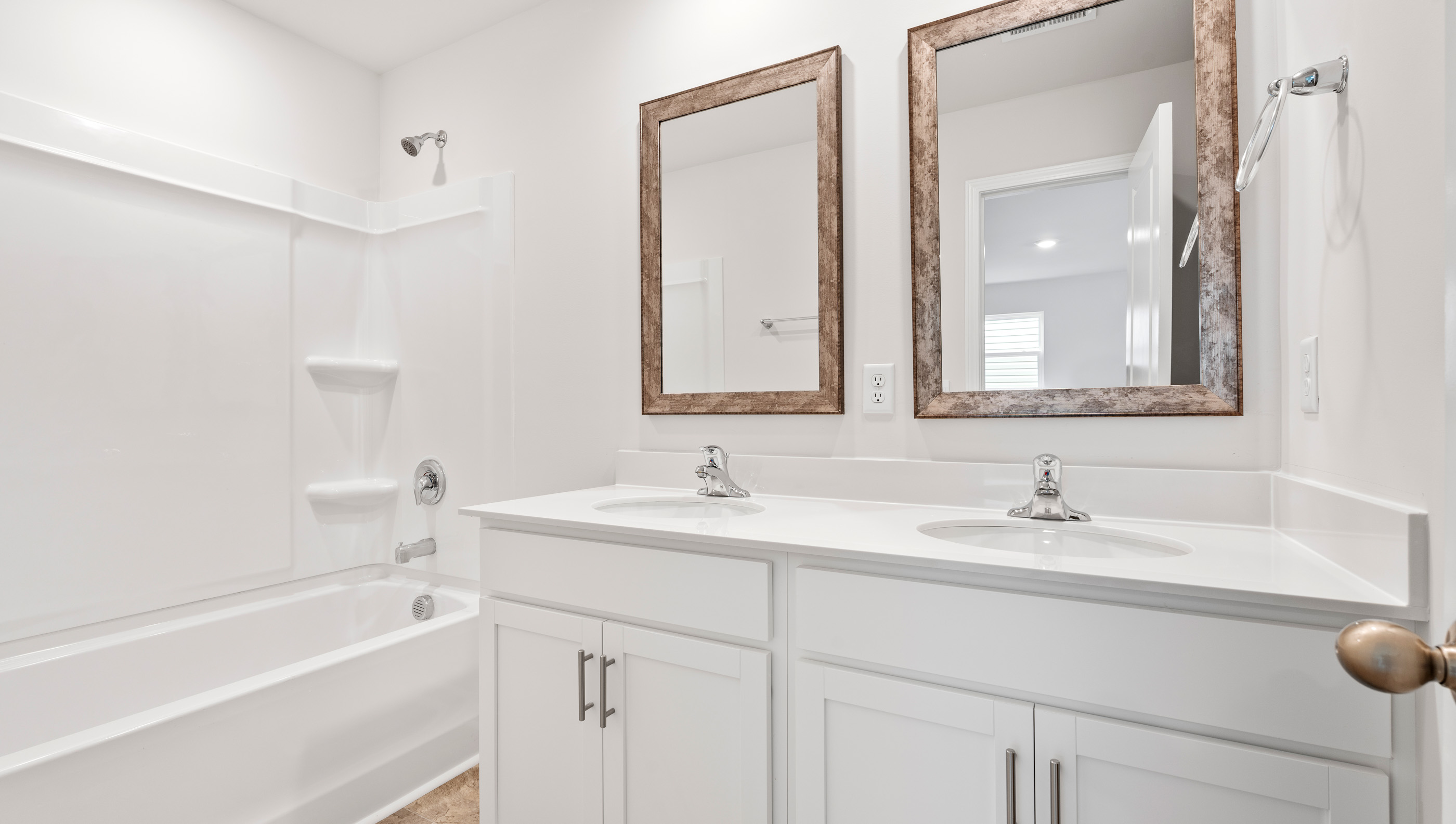 Bathroom with vanity and tub.