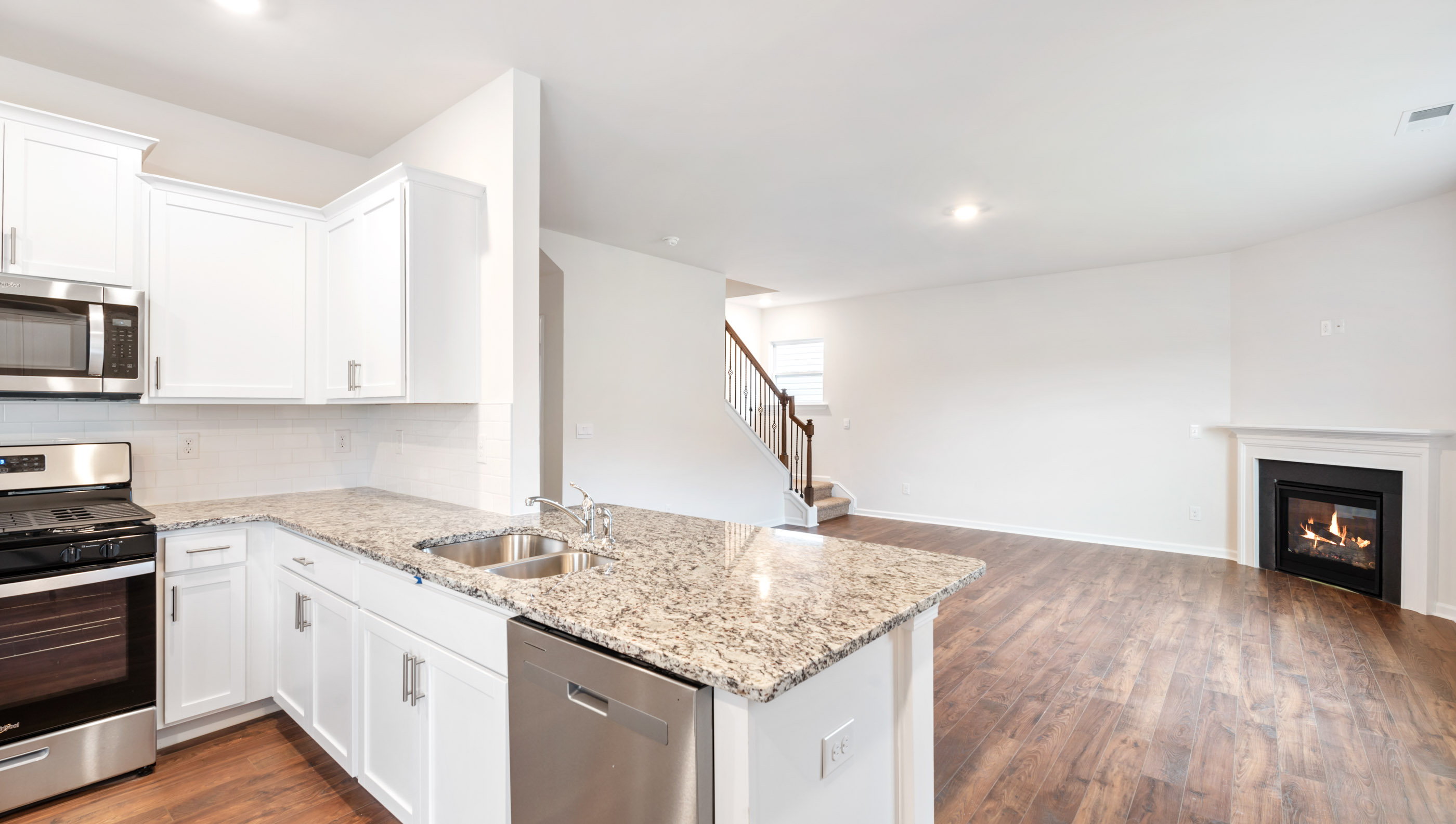 Kitchen with island and granite countertops.