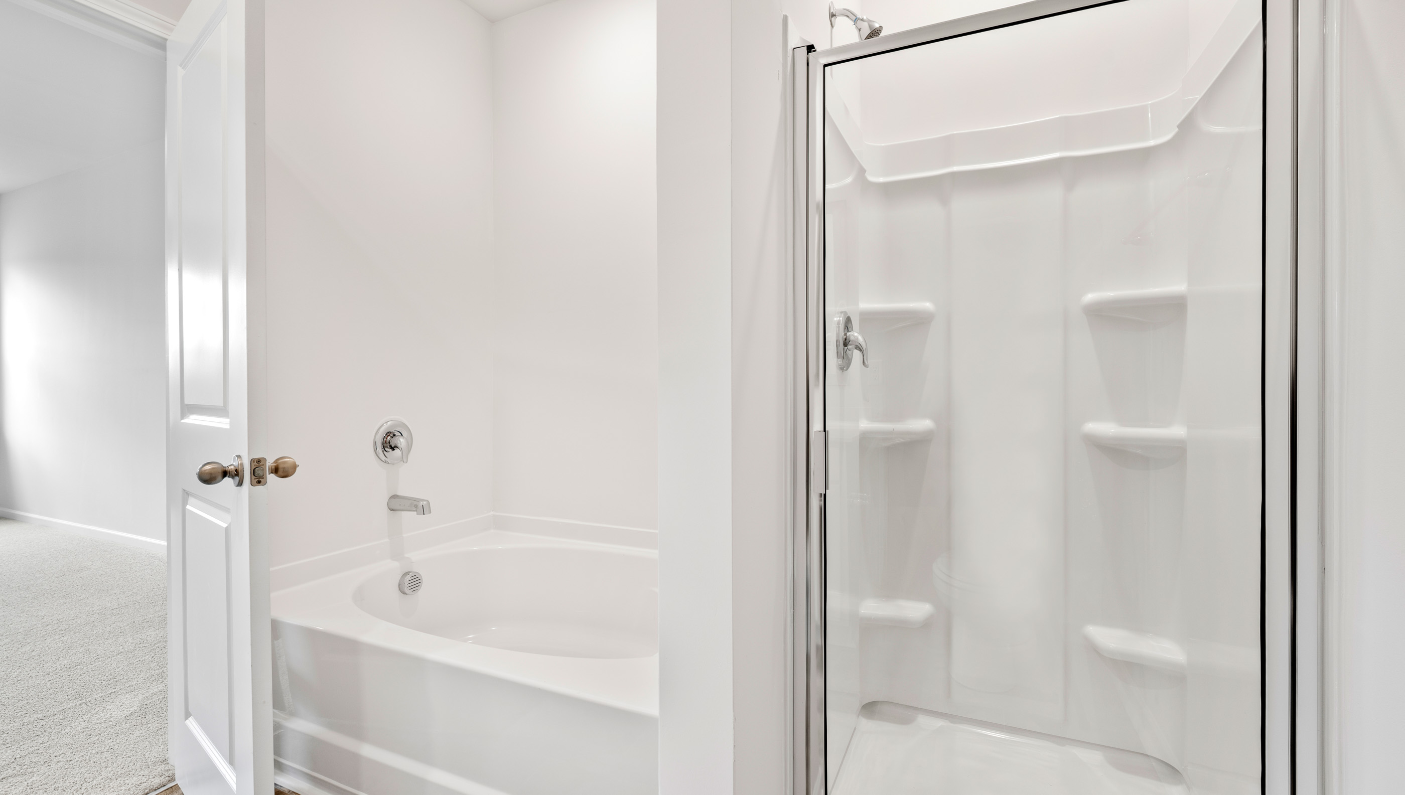 Bathroom with tub and walk in shower.
