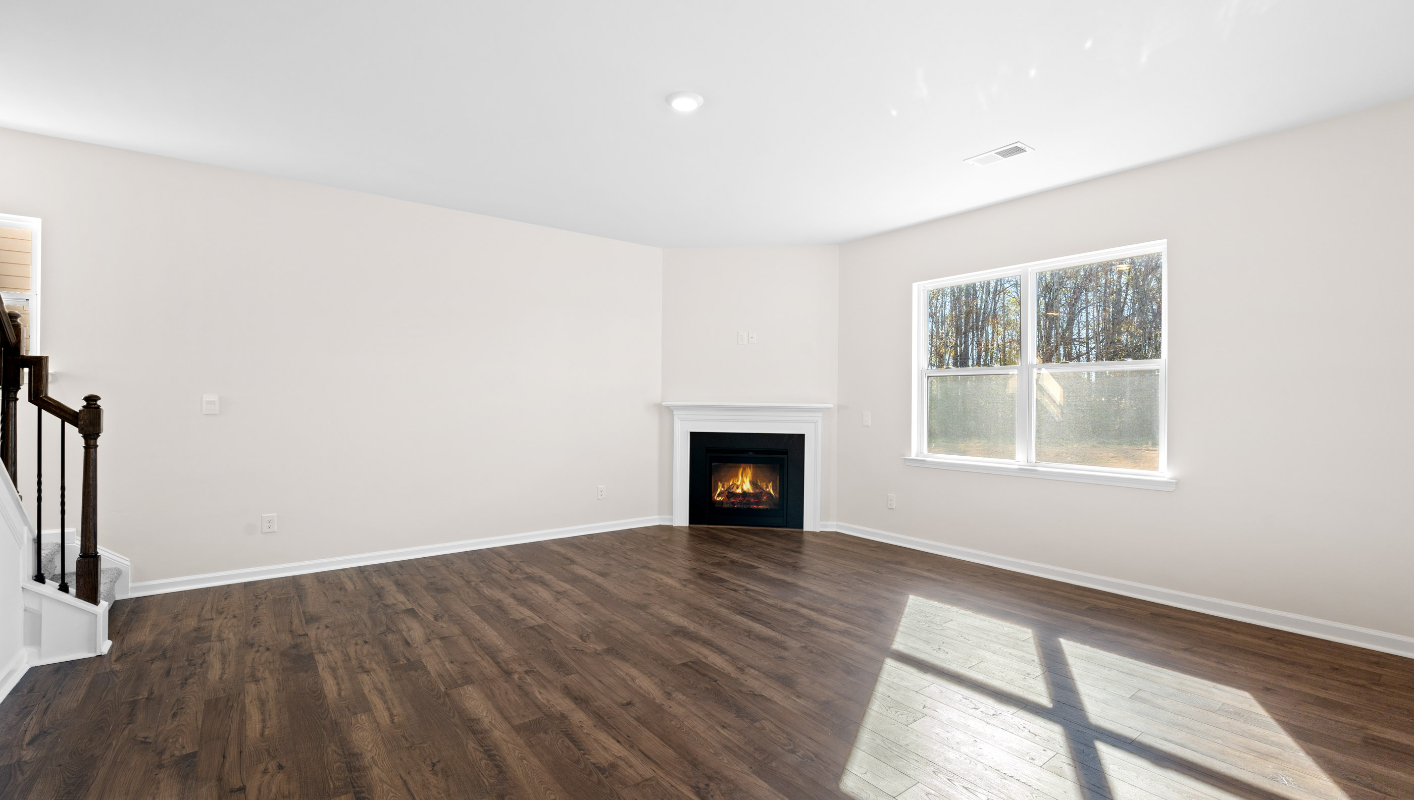Family room with windows and fireplace.