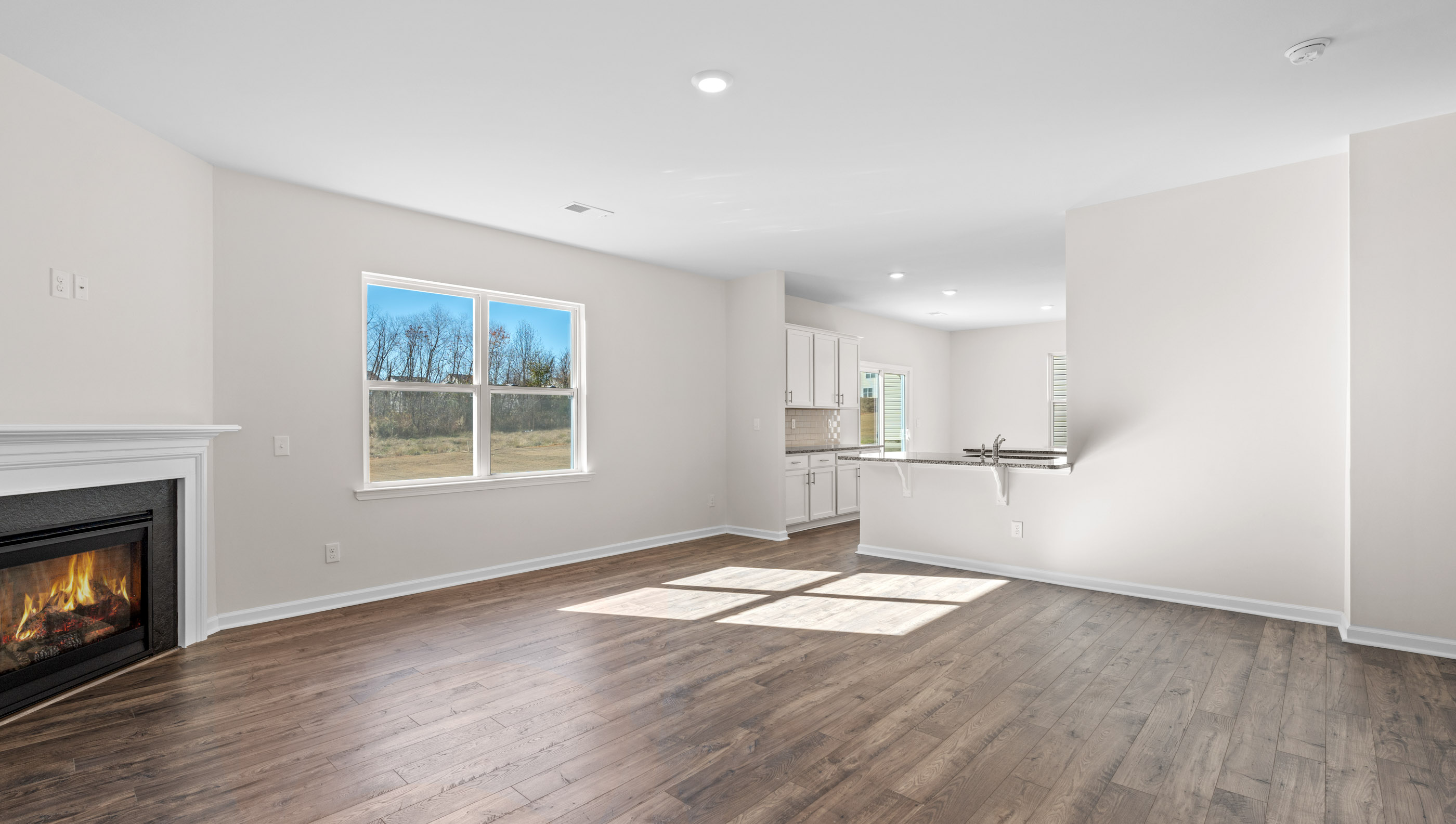 Family room with windows and fireplace.
