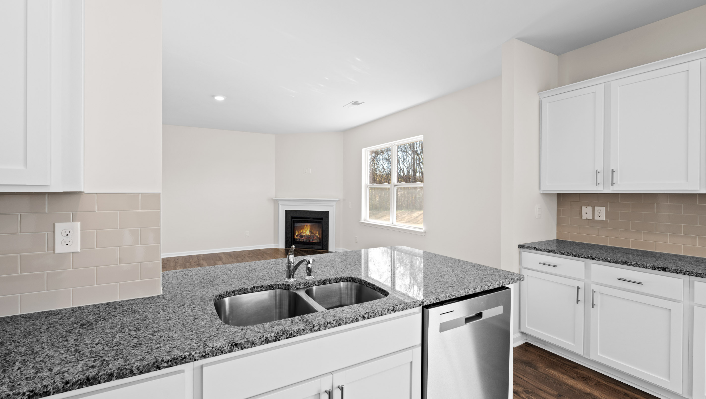 Kitchen with granite countertops and stainless steel appliances.