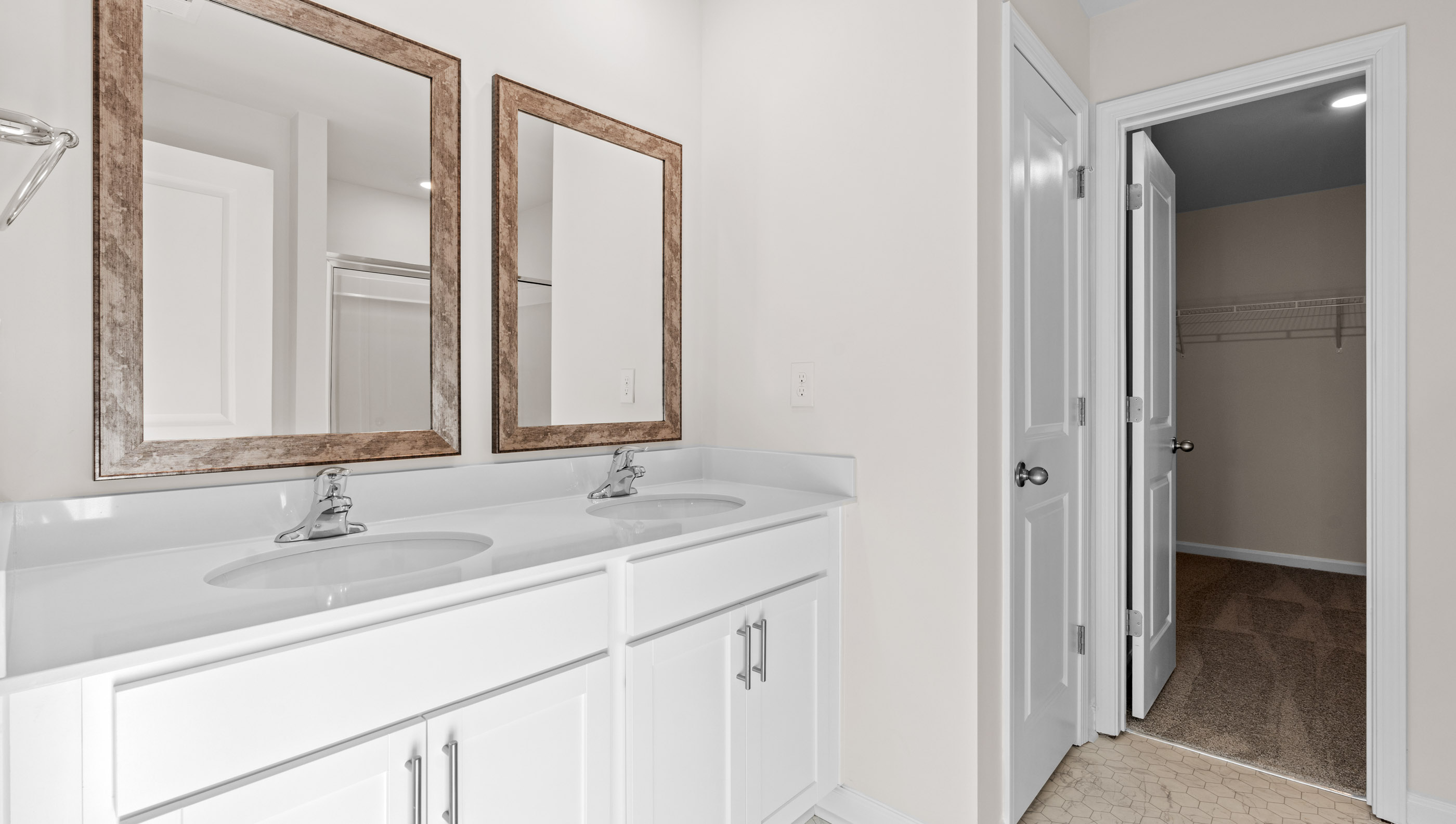 Bathroom with dual vanity.