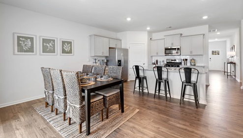 Dining room area with view of kitchen.