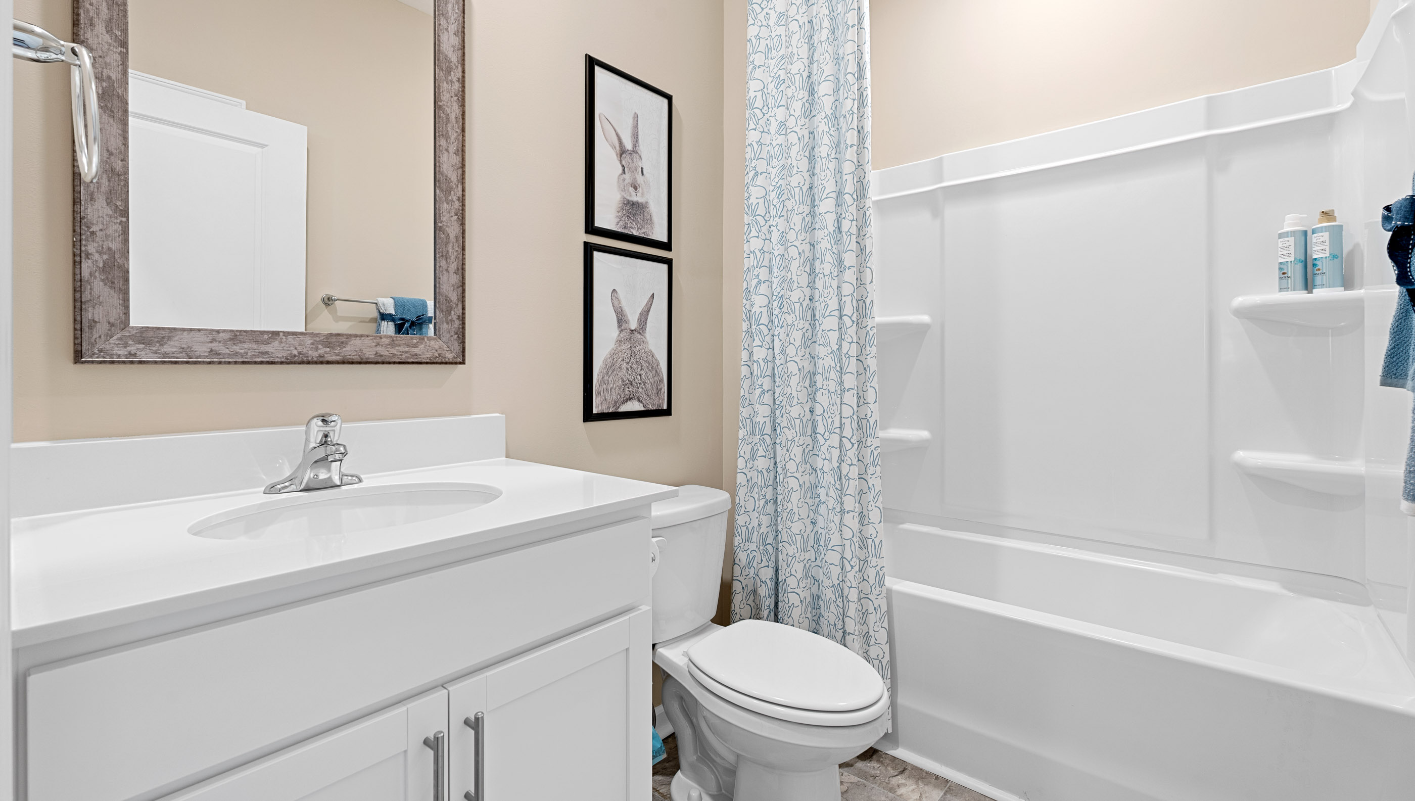 Bathroom with single vanity sink and tub.
