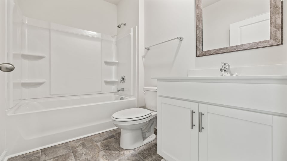 Bathroom with vanity and tub.