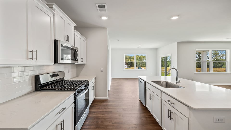 Kitchen and island with granite countertops.
