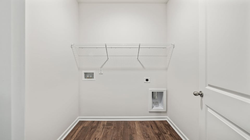 Walk in laundry with shelves.