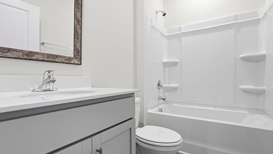 Bathroom with vanity and tub.