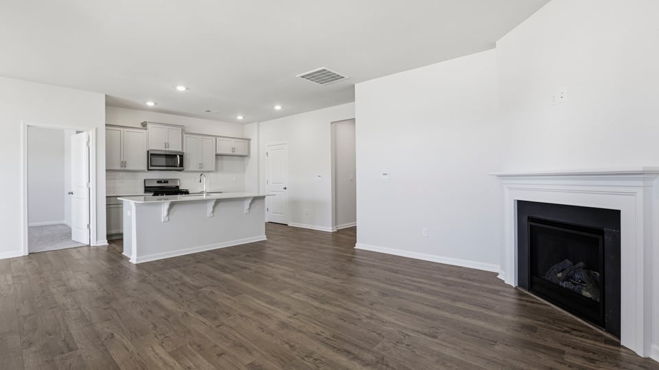 Livingroom with fireplace and window.