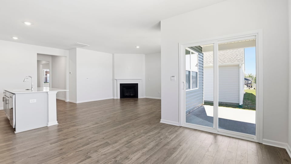 Livingroom and dining room with fireplace.