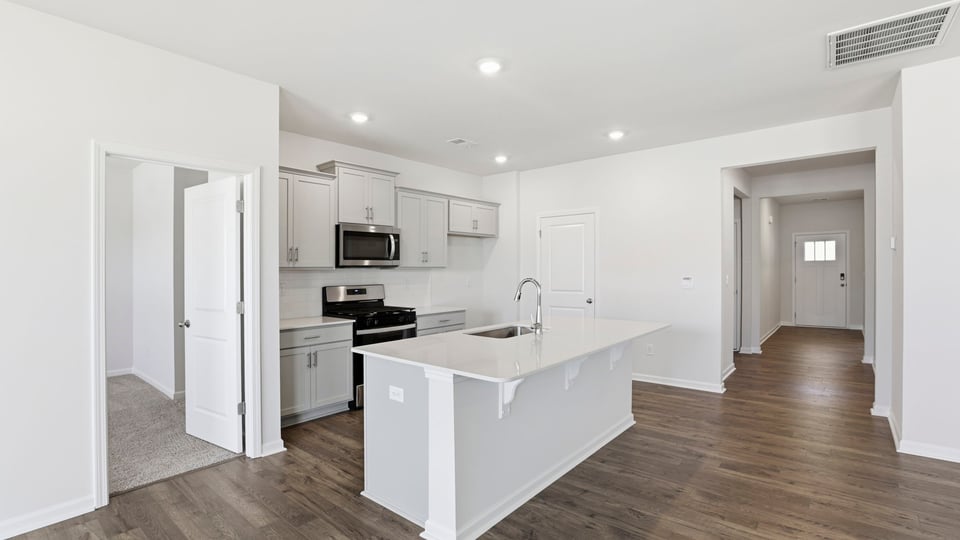 Kitchen with island and countertops.