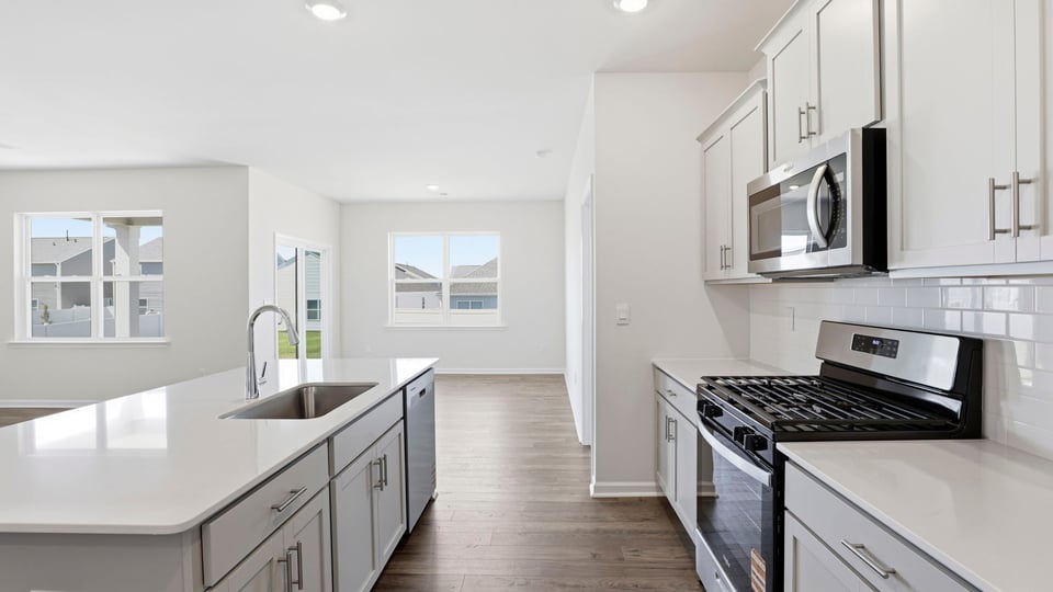 Kitchen with island and countertops.
