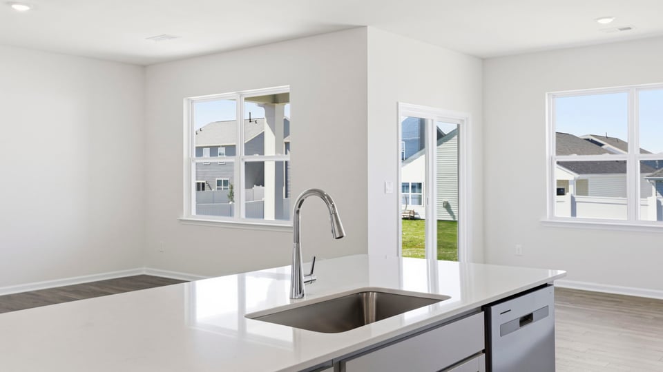 Kitchen with island and countertops.