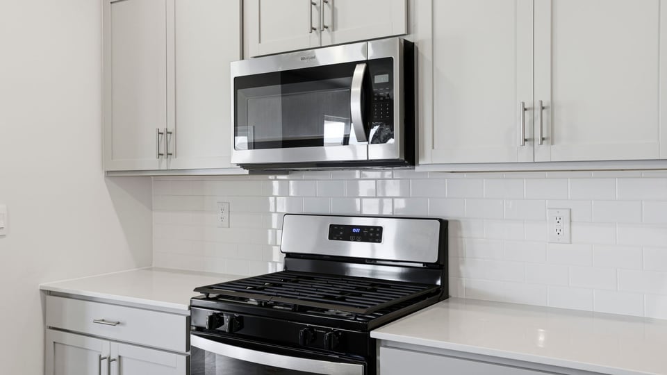 Kitchen with island and countertops.