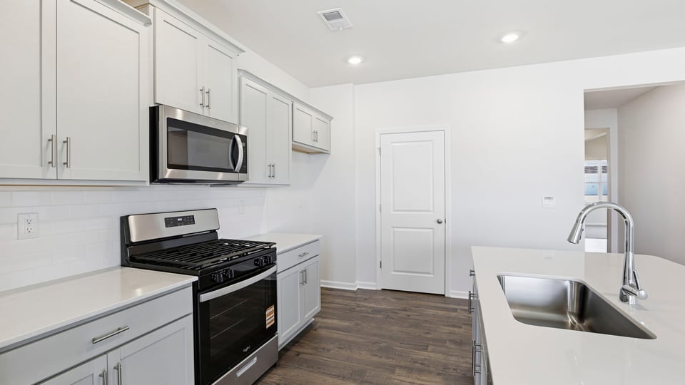 Kitchen with island and countertops.